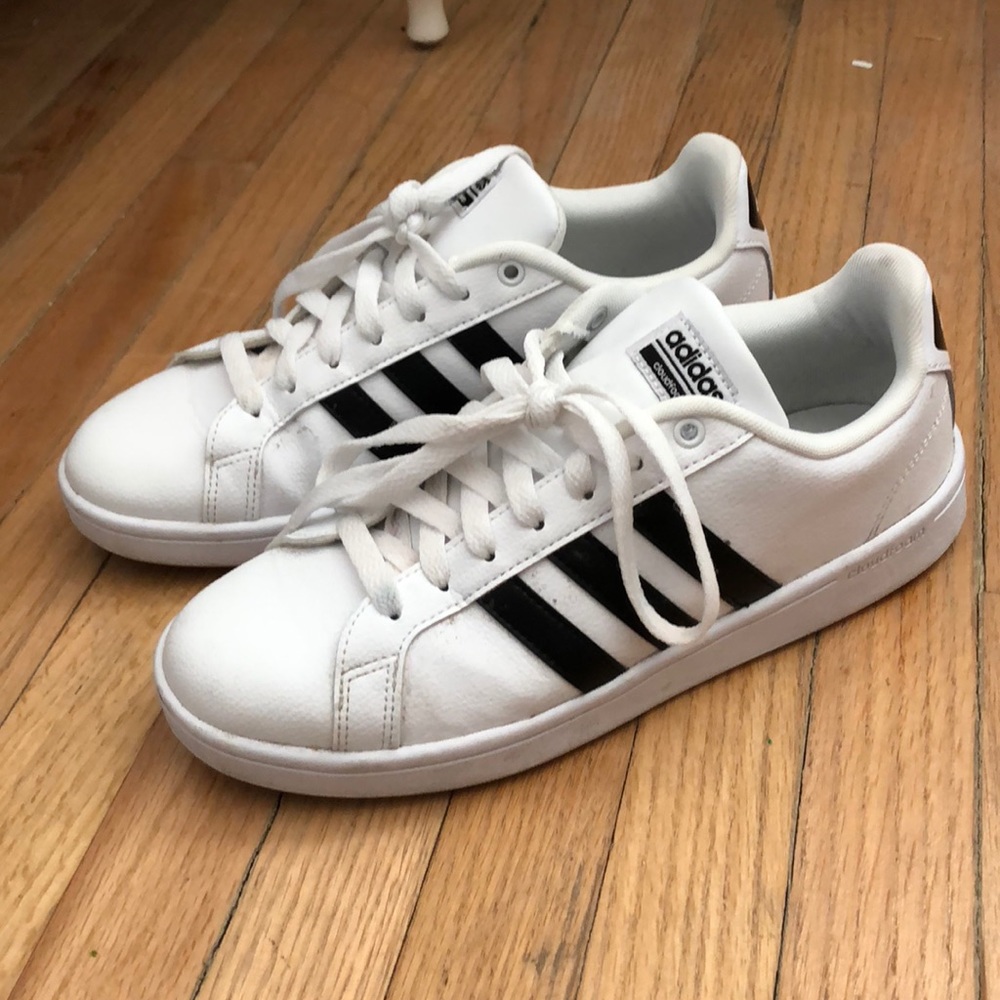 White Adidas with black stripes